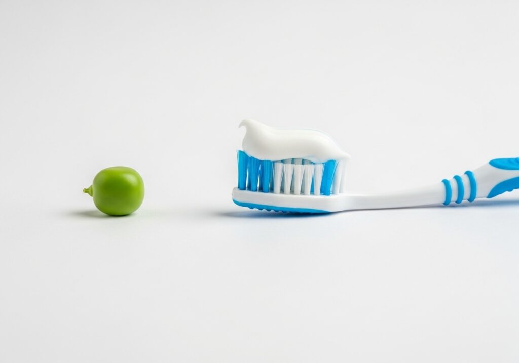 완두콩과 완두콩 크기로 짠 치약을 비교하는 이미지